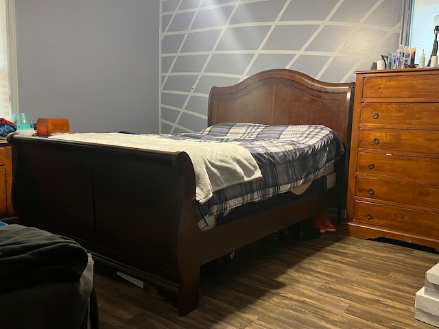 bedroom featuring hardwood / wood-style floors