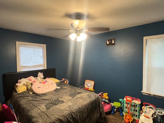 bedroom featuring wood-type flooring and ceiling fan