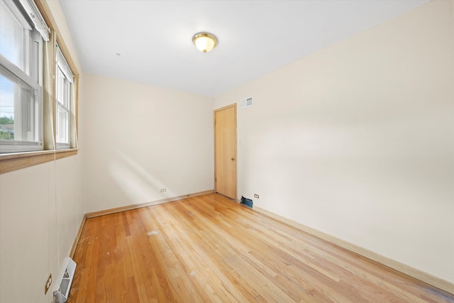 spare room with light hardwood / wood-style floors