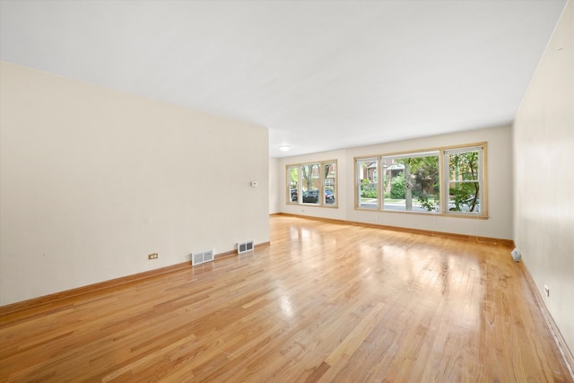 unfurnished living room featuring light hardwood / wood-style floors