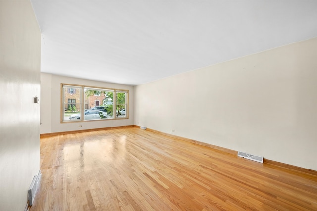 unfurnished living room featuring light hardwood / wood-style flooring