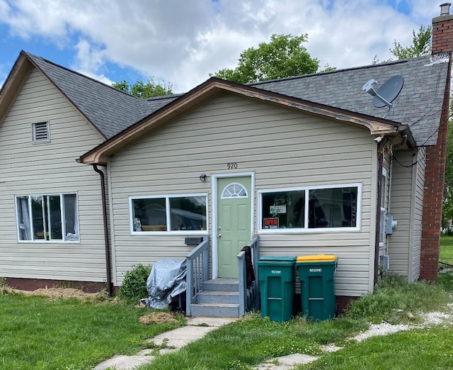 view of front of home featuring a chimney
