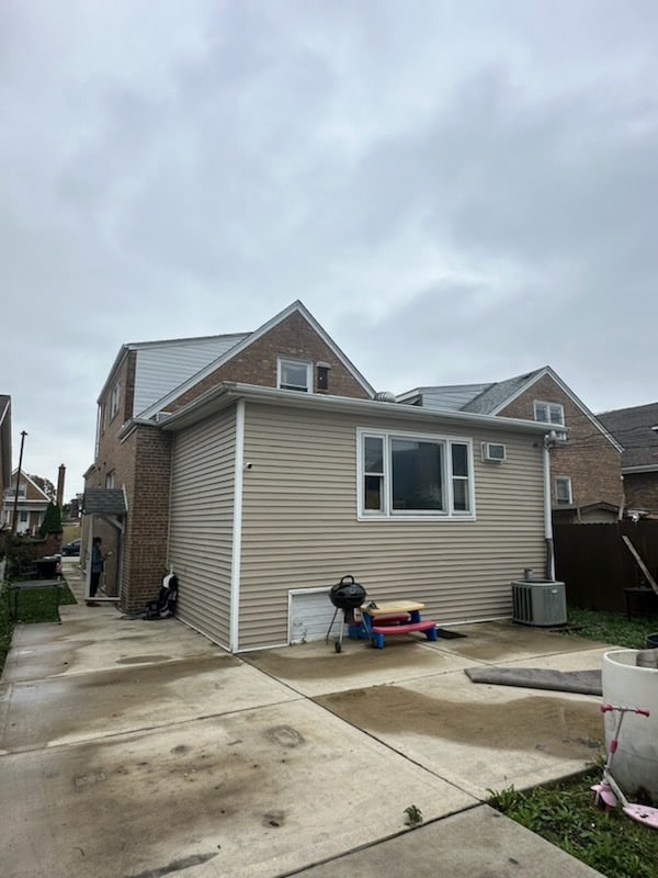 back of house featuring a patio and central AC unit