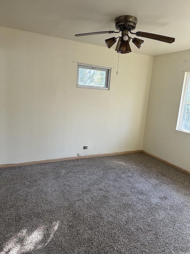 16515 S Ashland Ave, Markham, IL 60428 - spare room with carpet floors, a ceiling fan, baseboards, and a healthy amount of sunlight