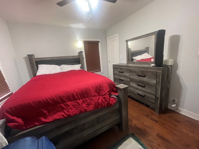 bedroom with ceiling fan and dark wood-type flooring