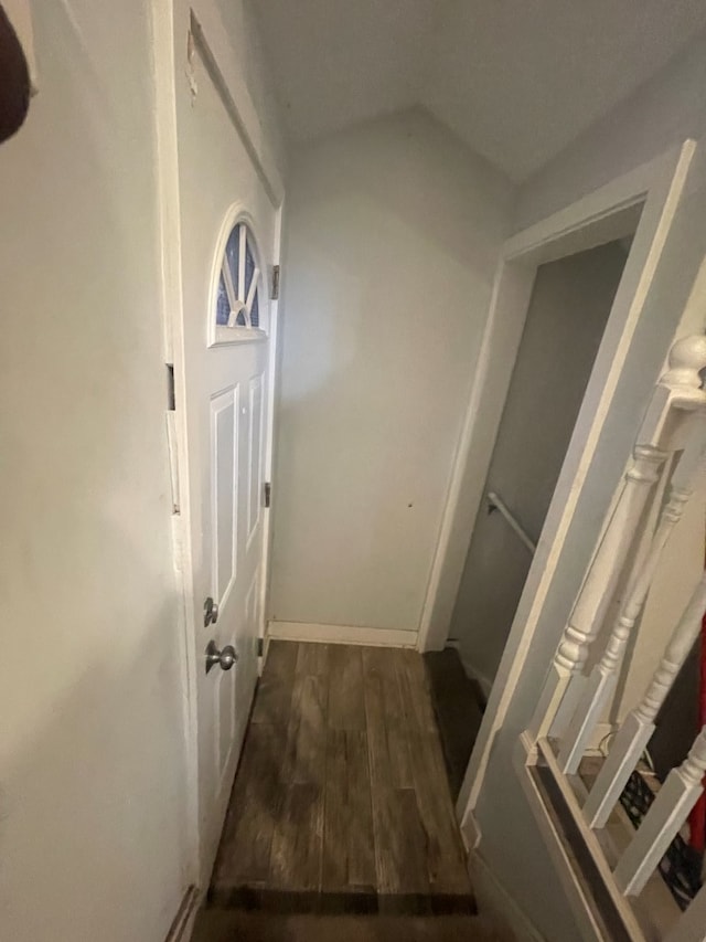 corridor with dark wood-type flooring