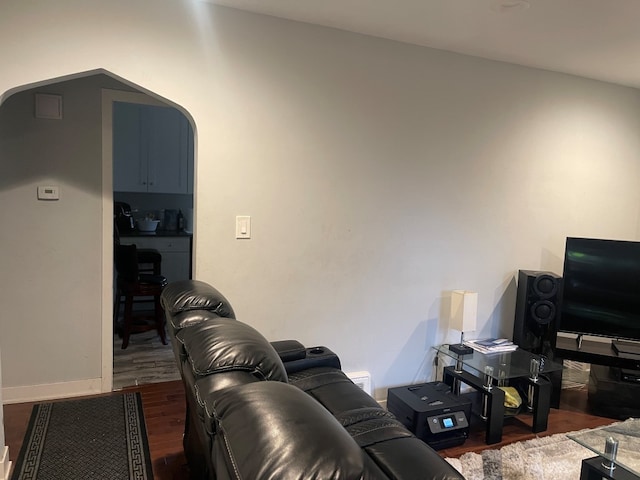 living room featuring dark wood-type flooring