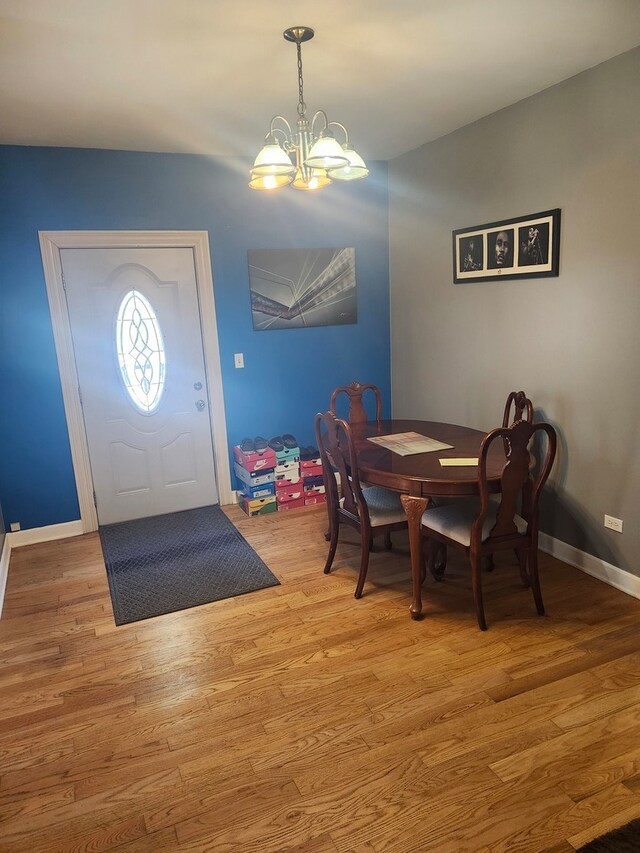 entryway featuring a notable chandelier and hardwood / wood-style flooring