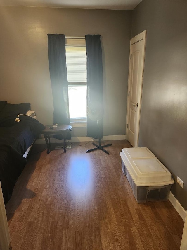 202 S Birch St, Wenona, IL 61377 - bedroom featuring wood finished floors and baseboards