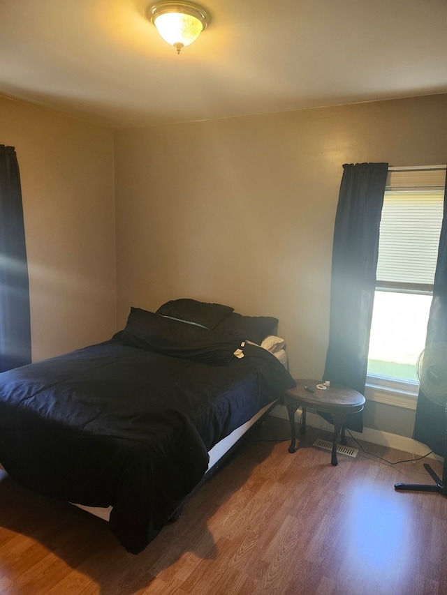 bedroom featuring hardwood / wood-style flooring