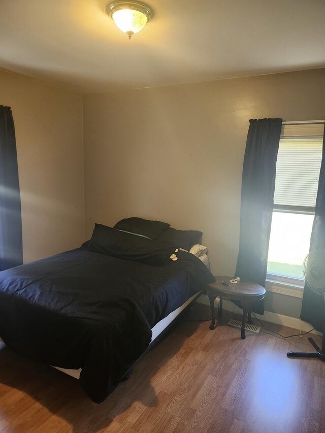 202 S Birch St, Wenona, IL 61377 - bedroom featuring wood finished floors and baseboards