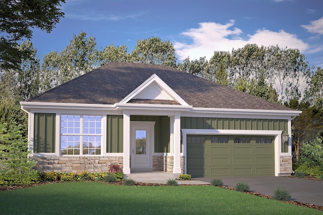 view of front facade with a front yard, a garage, and covered porch