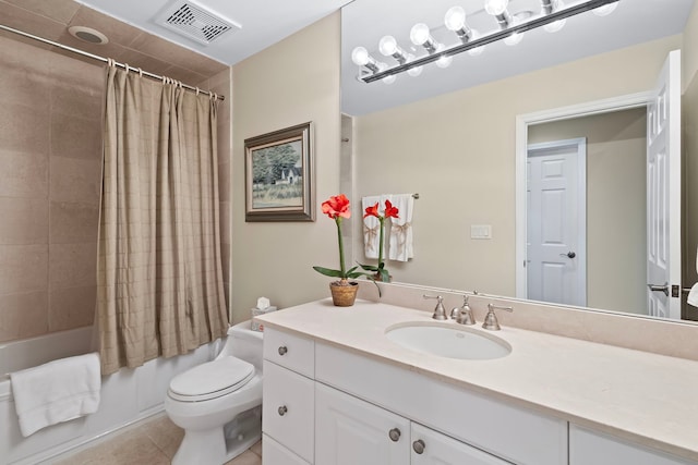 full bathroom featuring shower / bath combination with curtain, tile patterned floors, vanity, and toilet