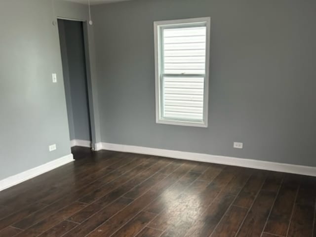 empty room featuring dark hardwood / wood-style floors