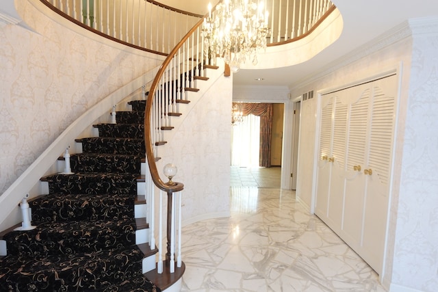 stairs featuring crown molding