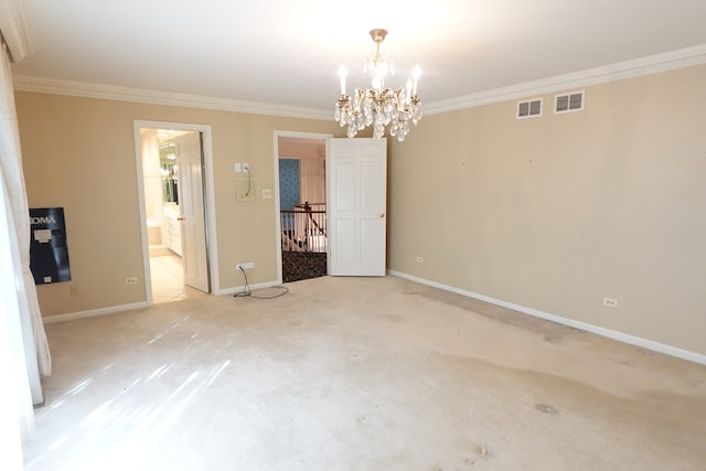 empty room featuring light colored carpet, a notable chandelier, and ornamental molding