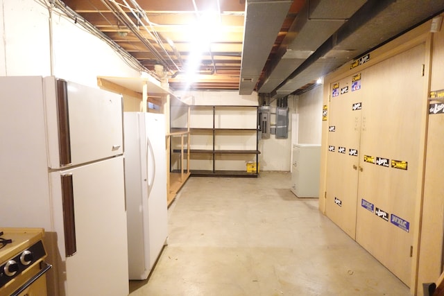 basement with white refrigerator