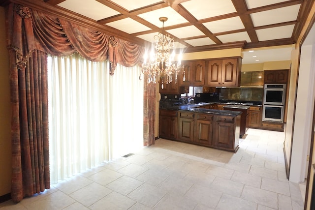 kitchen featuring plenty of natural light, coffered ceiling, stainless steel appliances, and tasteful backsplash