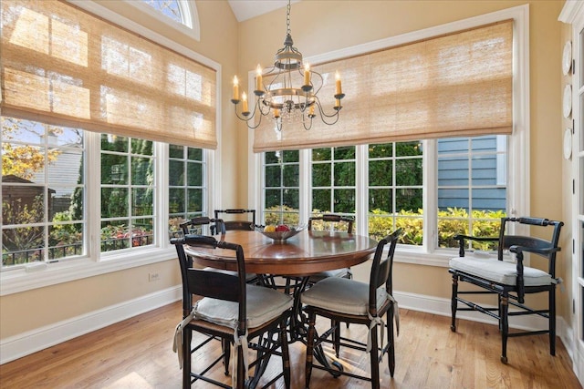 sunroom featuring a chandelier