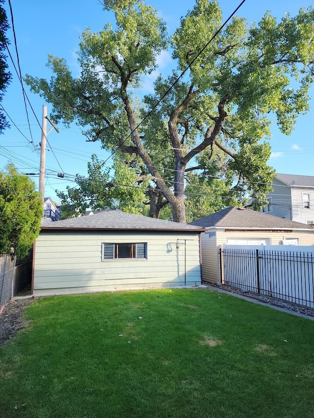 back of property featuring a yard