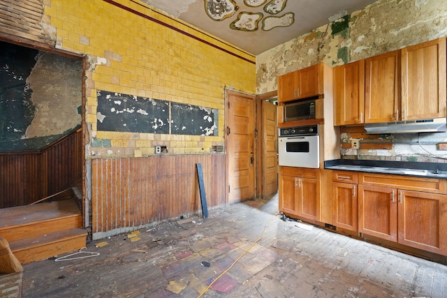 kitchen featuring white oven and cooktop