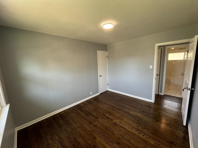 empty room featuring dark hardwood / wood-style flooring