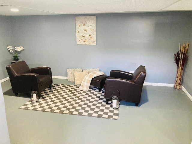 living area with concrete flooring