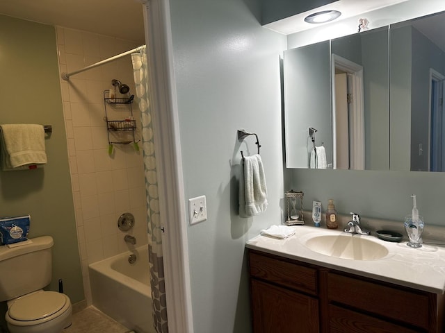 full bathroom featuring shower / tub combo, vanity, tile patterned floors, and toilet