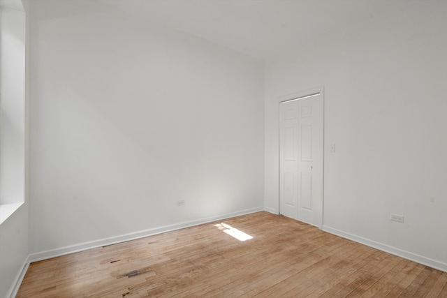 spare room with light hardwood / wood-style floors