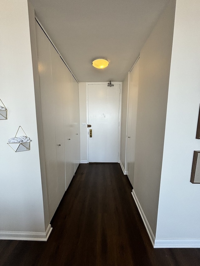 corridor featuring dark hardwood / wood-style floors