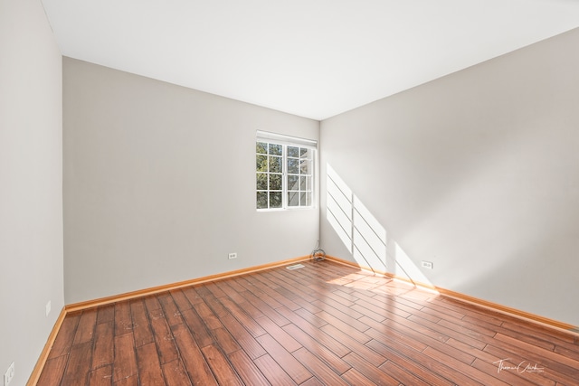 unfurnished room featuring wood-type flooring