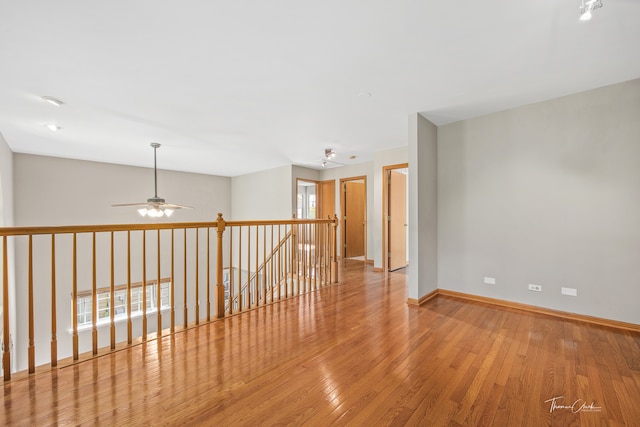 unfurnished room featuring ceiling fan and light hardwood / wood-style flooring