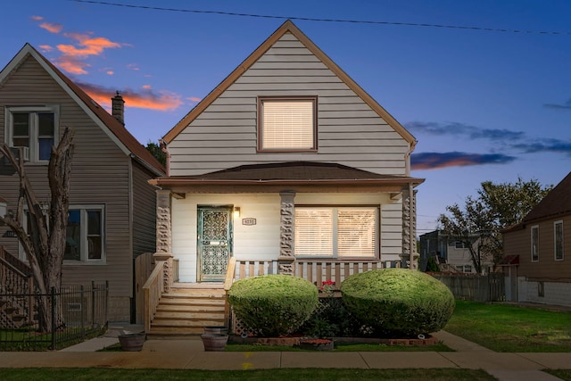 bungalow-style house with a yard