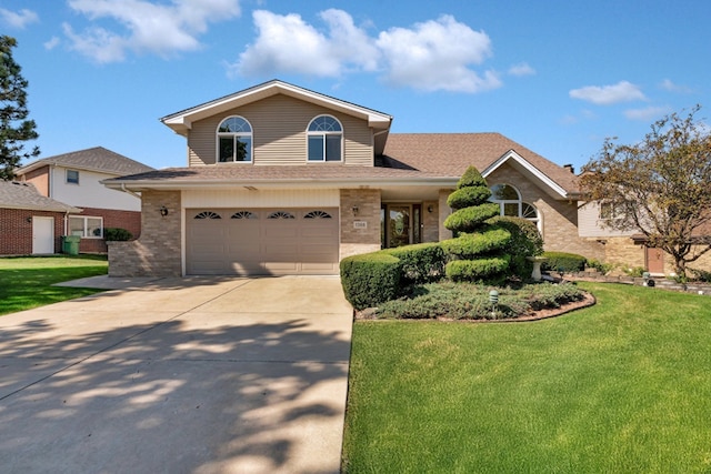 front of property with a front yard and a garage