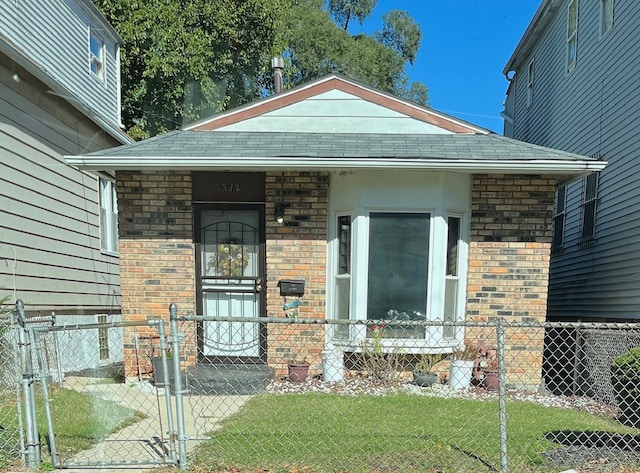 property entrance with a lawn