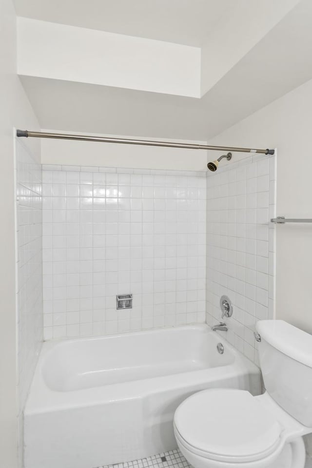 full bath with tile patterned floors, shower / bath combination, and toilet