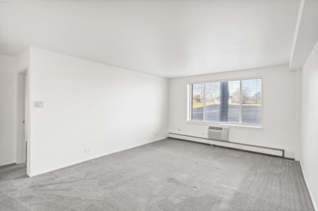 carpeted spare room featuring baseboards and baseboard heating