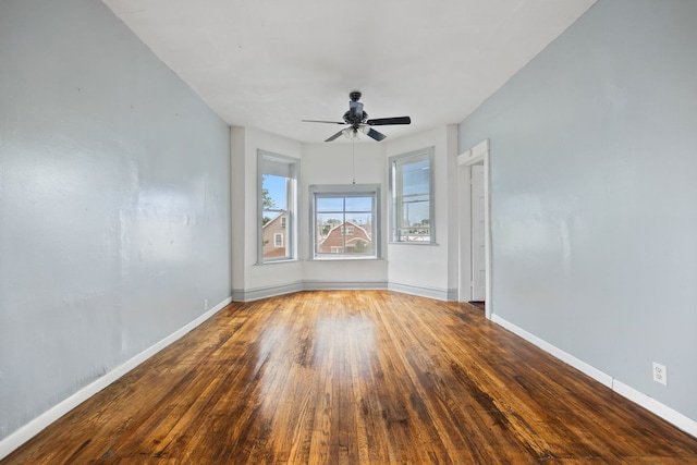 empty room featuring ceiling fan and hardwood / wood-style flooring