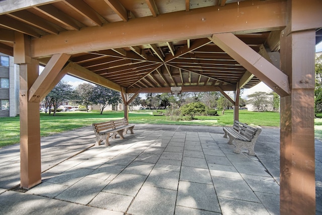 view of property's community featuring a patio, a gazebo, and a yard