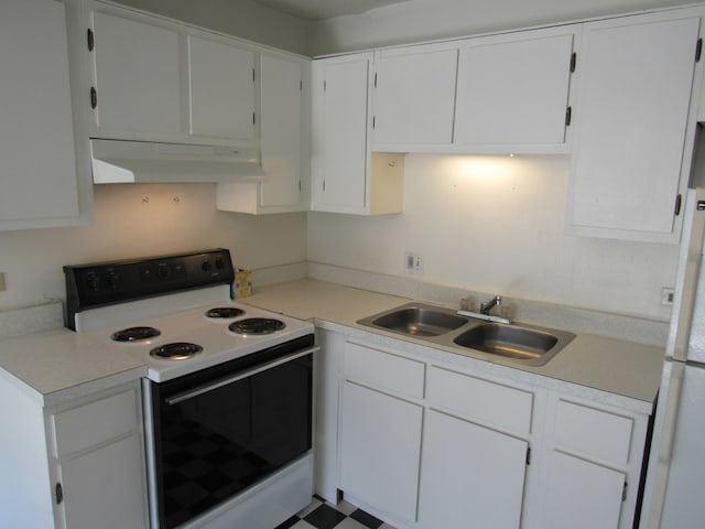 kitchen with white appliances, white cabinetry, and sink