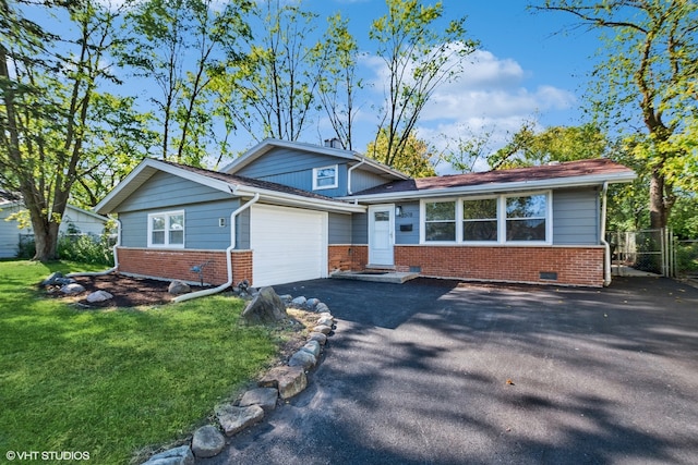 split level home with a front lawn