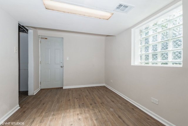 empty room featuring wood-type flooring