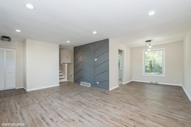 unfurnished living room featuring light wood-type flooring