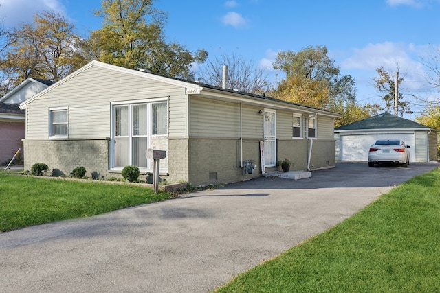 view of side of property with a garage, a yard, and an outdoor structure