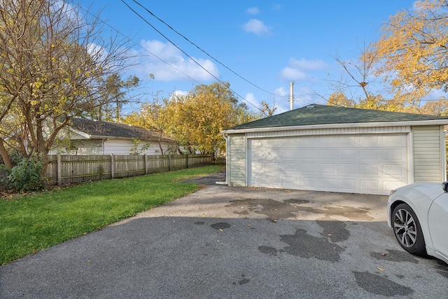 garage featuring a yard