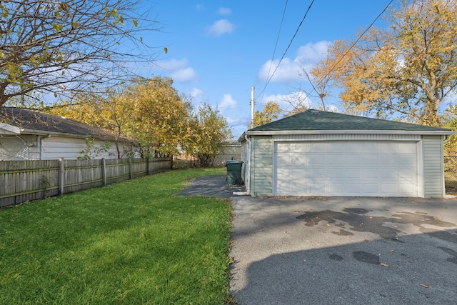 garage featuring a lawn