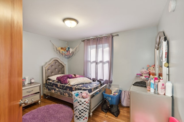 bedroom featuring wood-type flooring