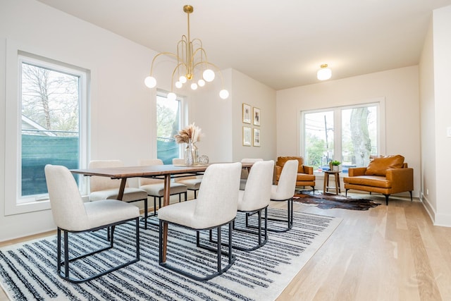 2715 Reese Ave, Evanston, IL 60201 - dining space with wood finished floors, baseboards, and a chandelier