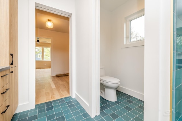 2715 Reese Ave, Evanston, IL 60201 - bathroom with toilet, a ceiling fan, tile patterned floors, and baseboards