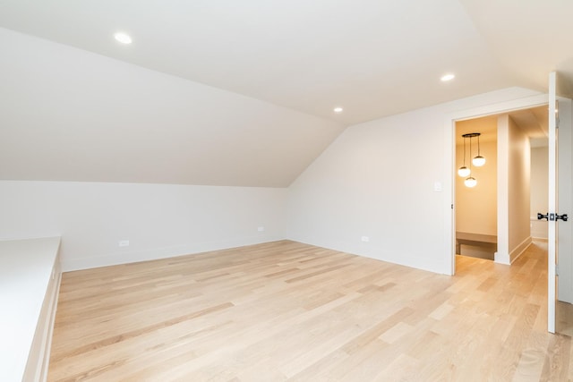 2715 Reese Ave, Evanston, IL 60201 - additional living space with lofted ceiling, light wood-style flooring, baseboards, and recessed lighting